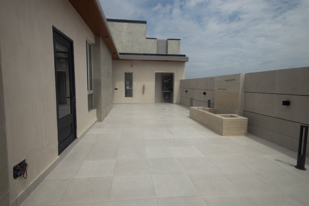Brum Height 6: Open rooftop terrace beside the upper-floor building